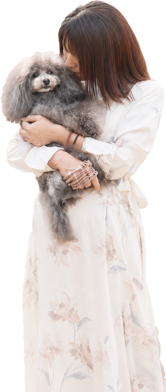 愛犬を抱きしめる女性